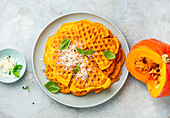 Hearty pumpkin waffles with parmesan cheese