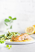 Marinated salmon with green beans, spring onions and lemons