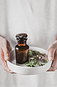 Apothecary bottle with herbs