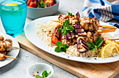 Chicken skewers with grilled vegetables and rice