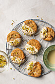 Biscuits with white chocolate icing and chopped pistachios