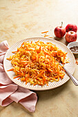 Sauerkraut salad with apples, carrots, olive oil and caraway seeds
