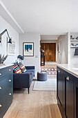 Cozy seating area next to the kitchen, overlooking the wide hallway