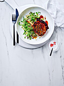 Grilled pork chop with sprout salad