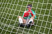 Goalkeeper holding a football