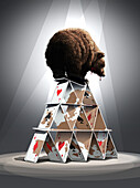 Bear on top of a house of cards with world map, illustration