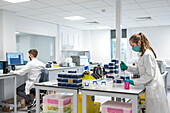Researcher pipetting in a laboratory
