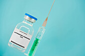 Syringe and vial of luteinizing hormone, conceptual image