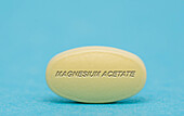 Magnesium acetate pill, conceptual image