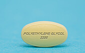 Polyethylene glycol 3350 pill, conceptual image