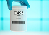Container of the food additive E495
