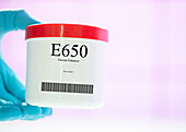 Container of the food additive E650