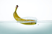 Banana splashing in water