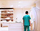Doctor checking MRI scanner