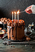 Lighting Candles on chocolate coffee cake
