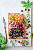 Puff pastry pie with different coloured raspberries
