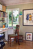 Desk with wooden chair in the wooden house