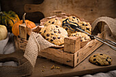 Vegan pumpkin-and-chocolate-chip cookies in a rustic wooden box