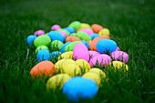 Colorful Plastic Easter Eggs on Green Grass, Selective Focus