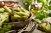 Fresh artichokes in a bowl