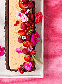 Tahin-cocoa tart with red berries