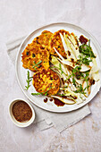 Carrot and pumpkin pancakes with chicory and pear salad
