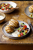 Fan potatoes with fennel mayo and tomatoes