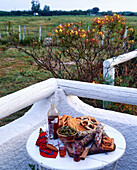 French hors d'oeuvres with red wine on a terrace table
