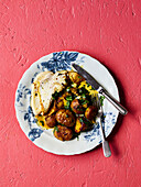 Golden-spiced roast chicken with potatoes