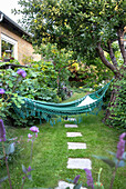 Hammock in lush garden