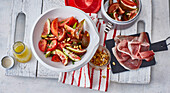 Tomato and fig salad with ham and pine nuts