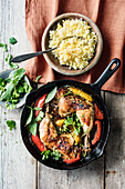 Chicken legs with peppers and saffron rice