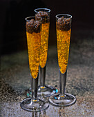 Vodka jelly with caviar served in champagne flutes