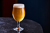 A glass of amber craft beer