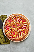 Marzipan tart with plums and pistachios