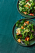 Kale salad with tadka dressing and naan croutons