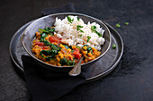 Vegan red lentil dal with tomatoes and spinach