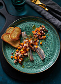 Herring and pumpkin salad with dill and roasted bread