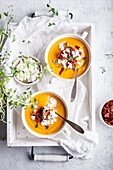 Carrot soup wit roasted bacon and cottage cheese