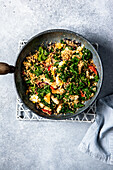 Egg fried cauliflower rice with chicken and kale