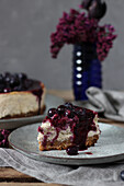New York Cheesecake with banana filling and blueberry sauce
