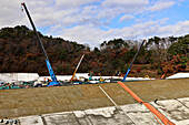 Bags of decontaminated radioactive waste being buried, Japan