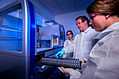 Scientists extracting bacterial DNA in a lab