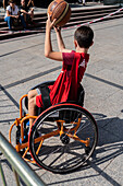 Boy playing wheelchair basketball, Zaragoza, Spain