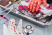Blood-covered surgical instruments, conceptual image