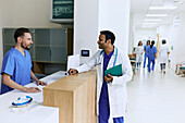 Doctor and nurse at hospital desk