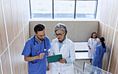 Doctor and nurse discussing patient care