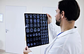 Doctor checking brain scans