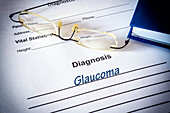 Glaucoma diagnosis on a medical form, conceptual image
