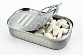 Tin metal containing white pills